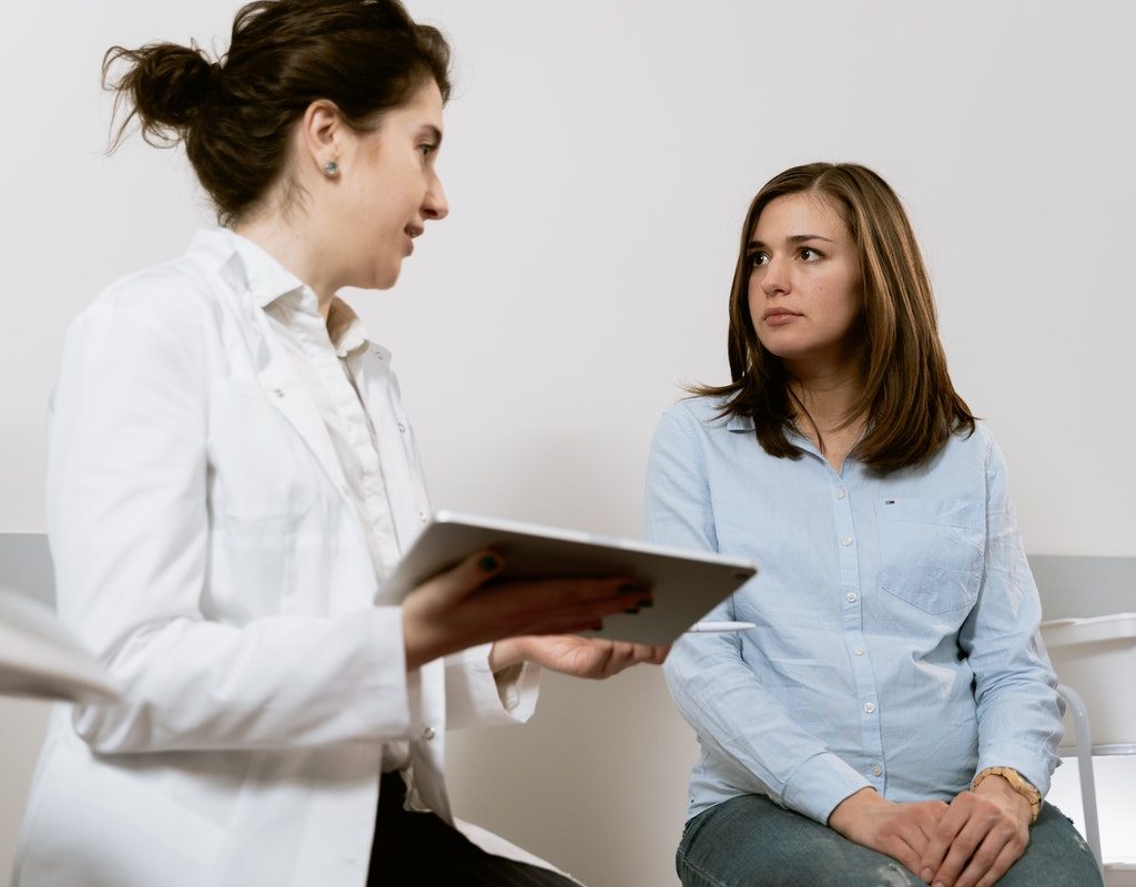 obstetrician talking with patient