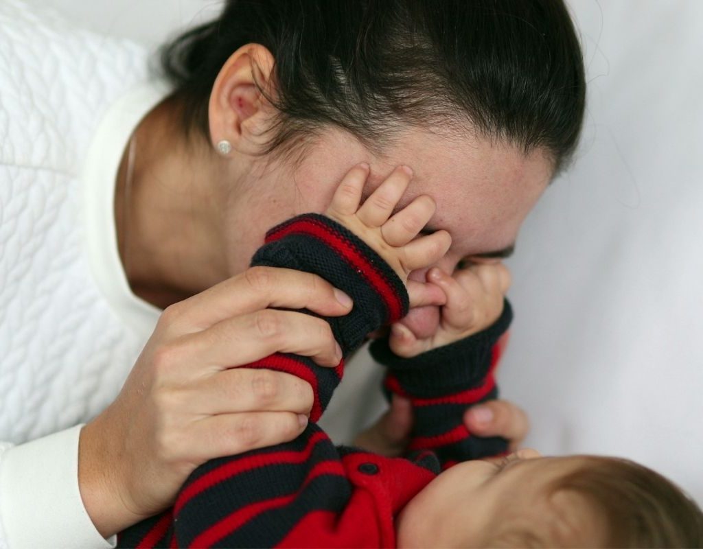Playing peekaboo with baby