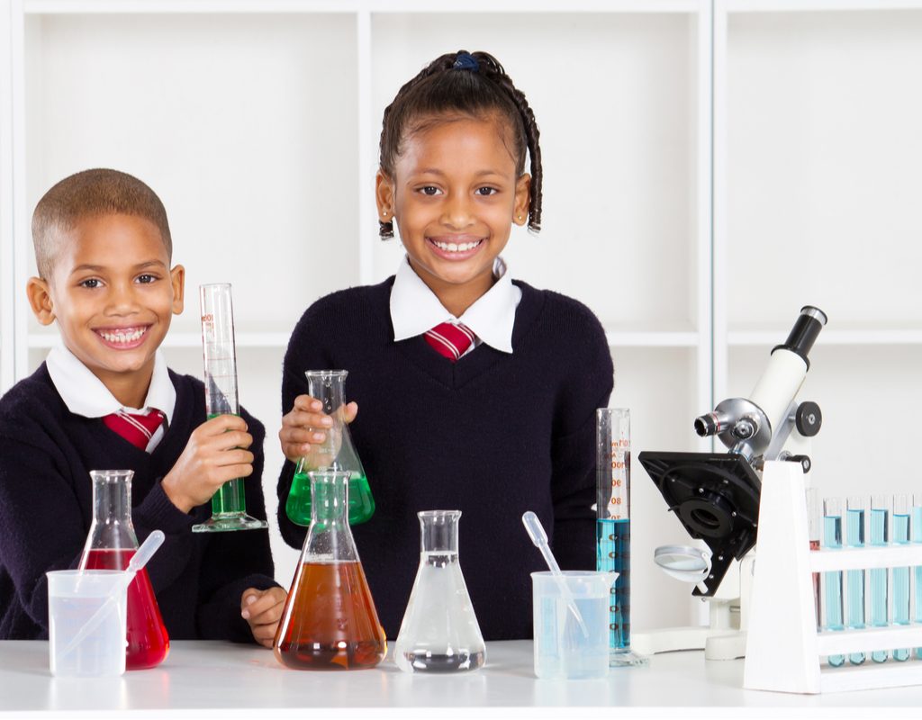 Two grade school kids doing a fun science experiment.