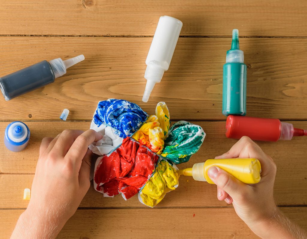 Applying the dye for a DIY tie-dye project.