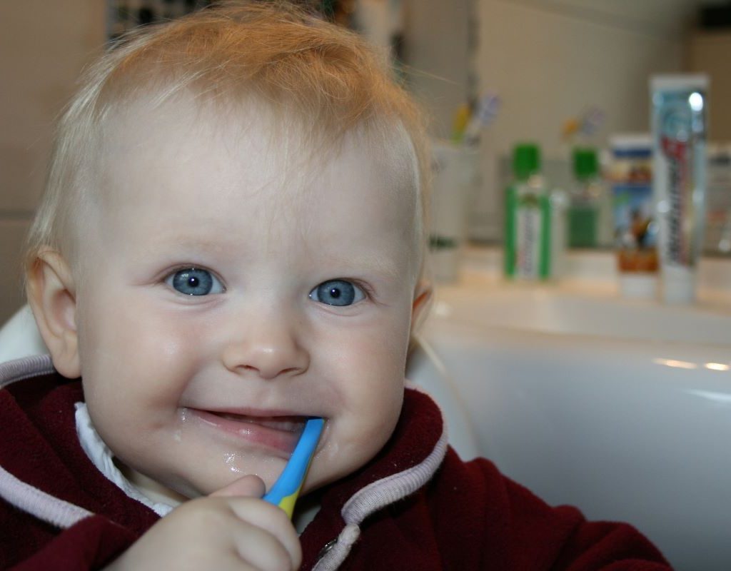 Young child brushing teeth