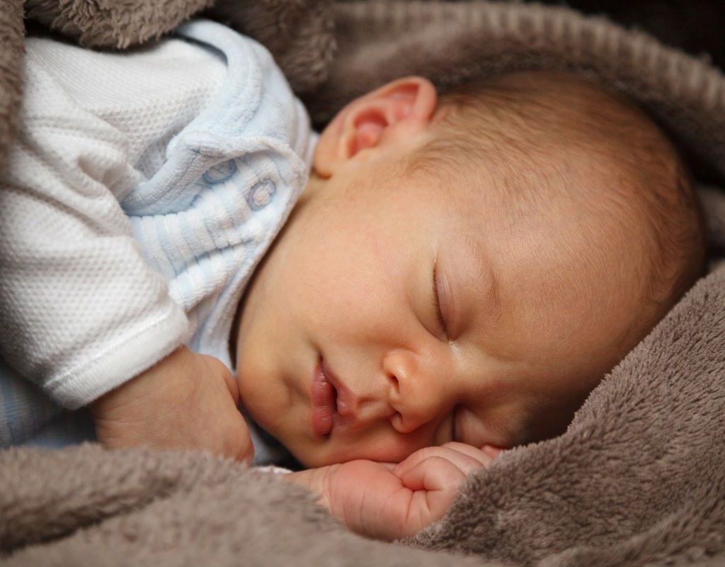 baby swaddled and sleeping