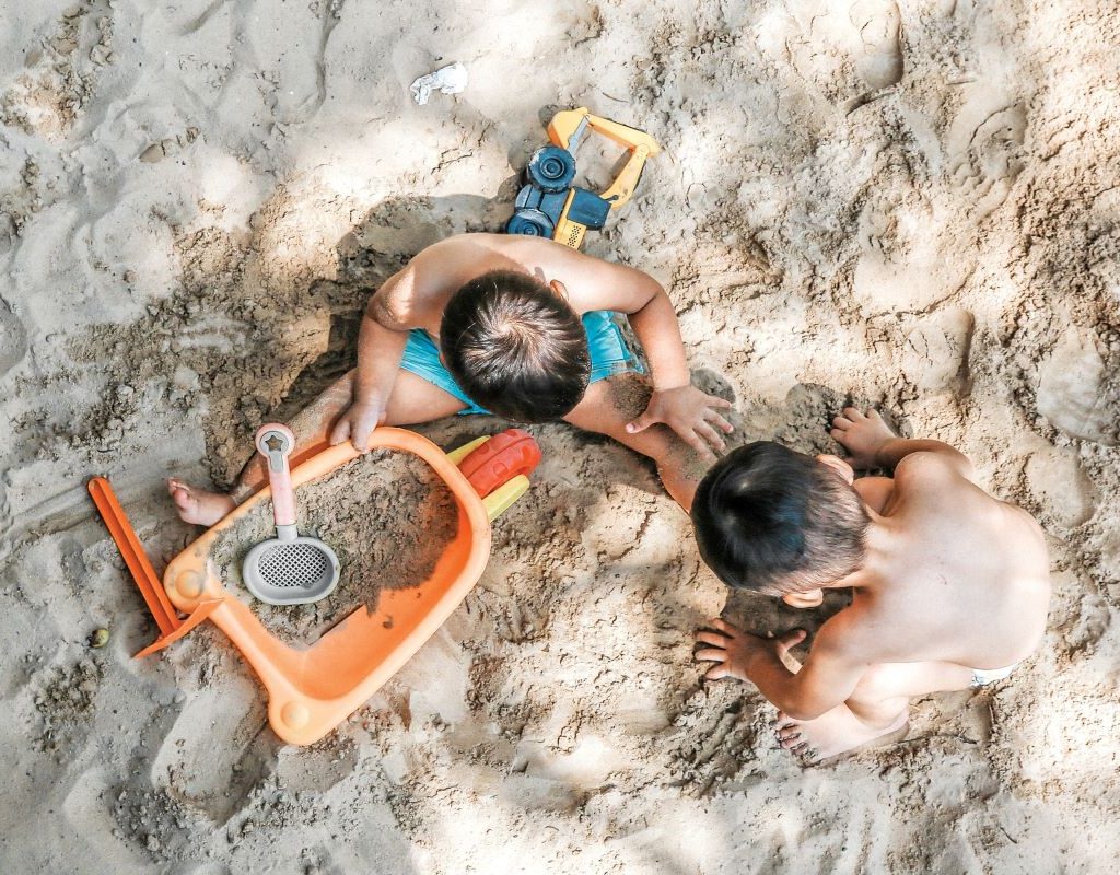 Boys building with sand