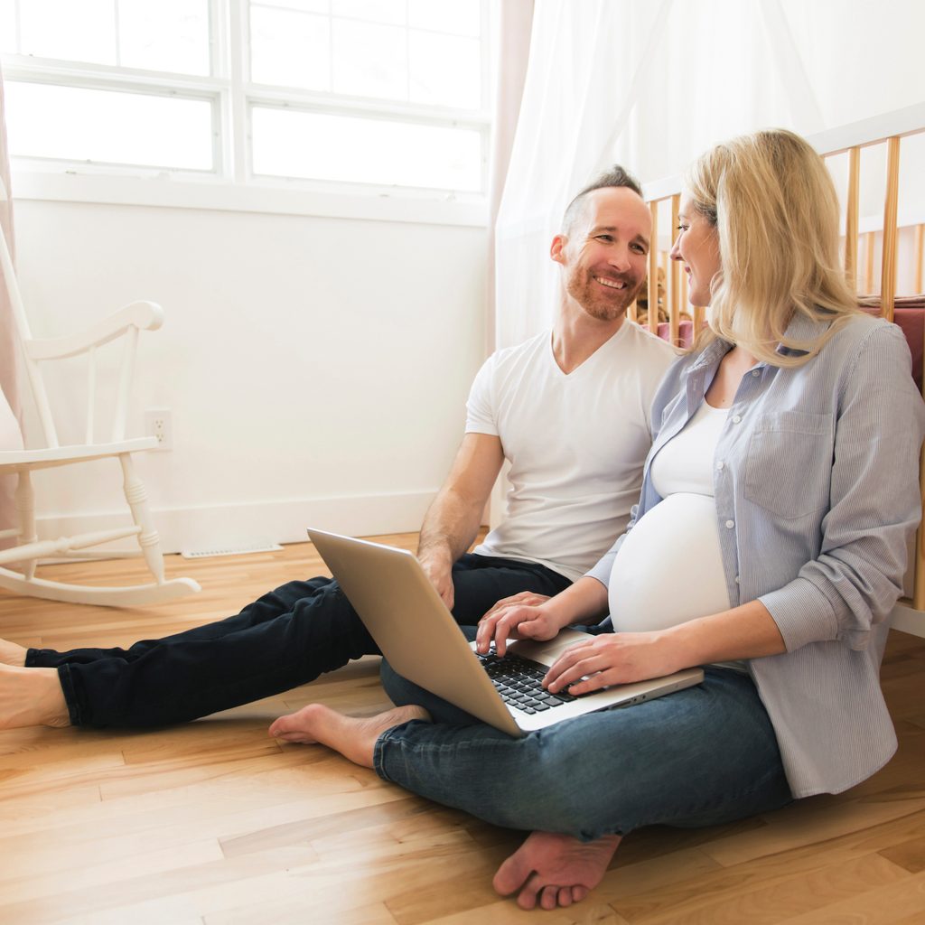 Couple sitting in the nursery.
