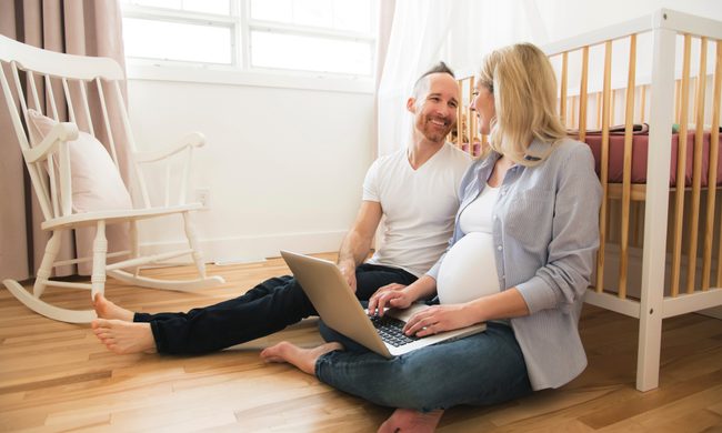 Couple sitting in the nursery