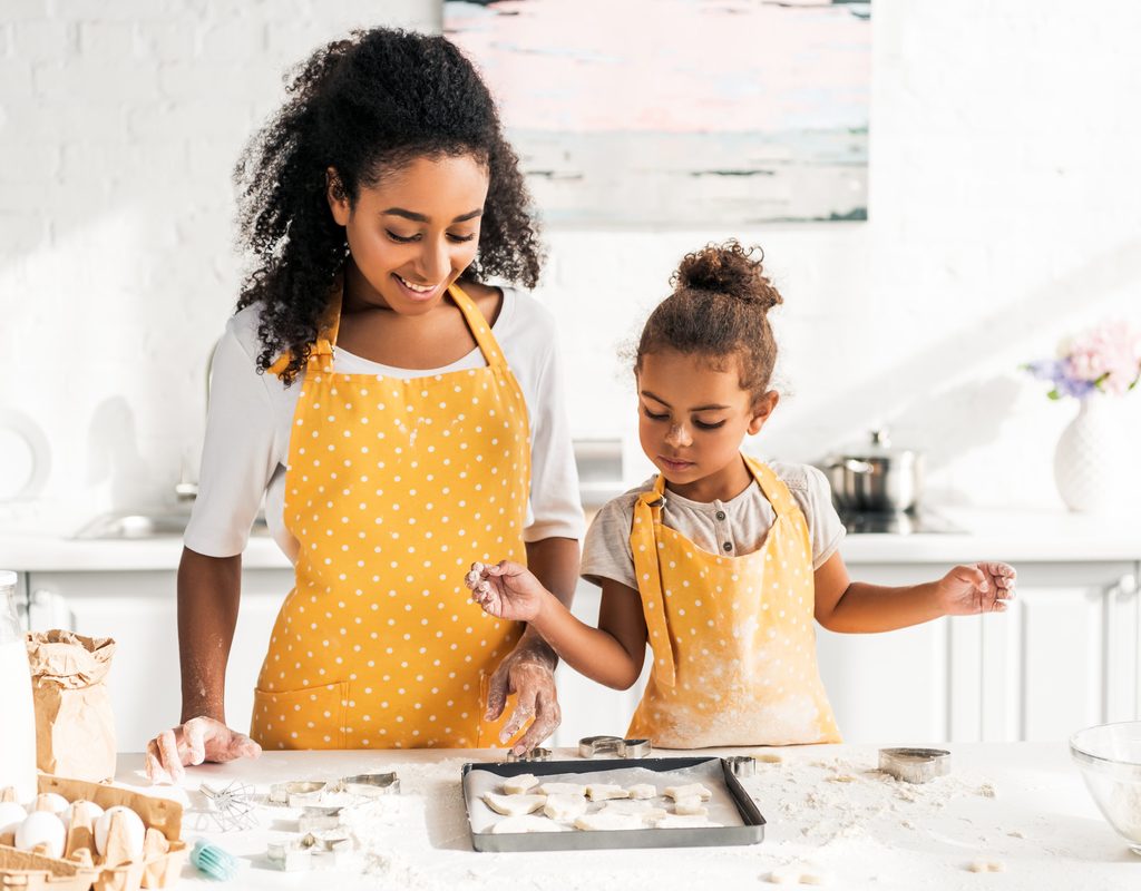 Mother and daughter having fun baking