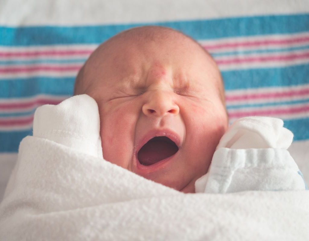 Newborn yawning or crying