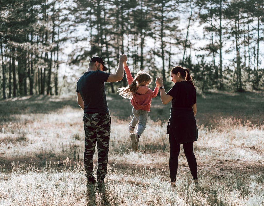 A family enjoying the beautiful outdoor weather.