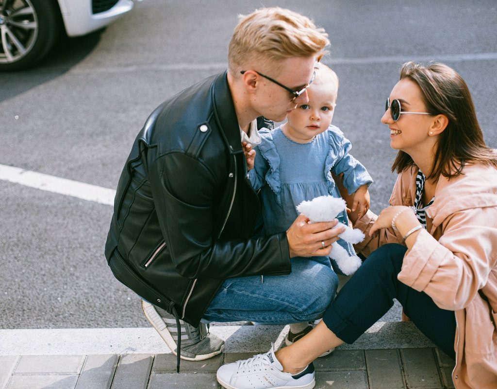 A family taking a break from walking around the city.