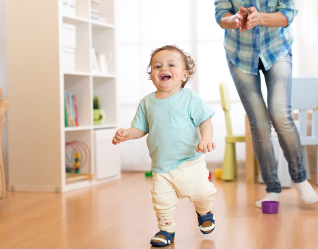 A mother chasing her toddler.