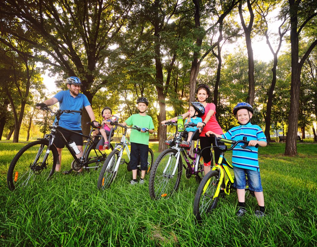 A family going on a bike ride.