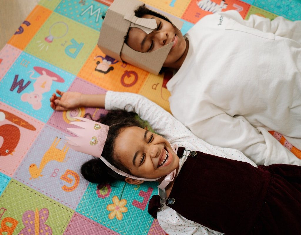 two siblings with royal, homemade costumes