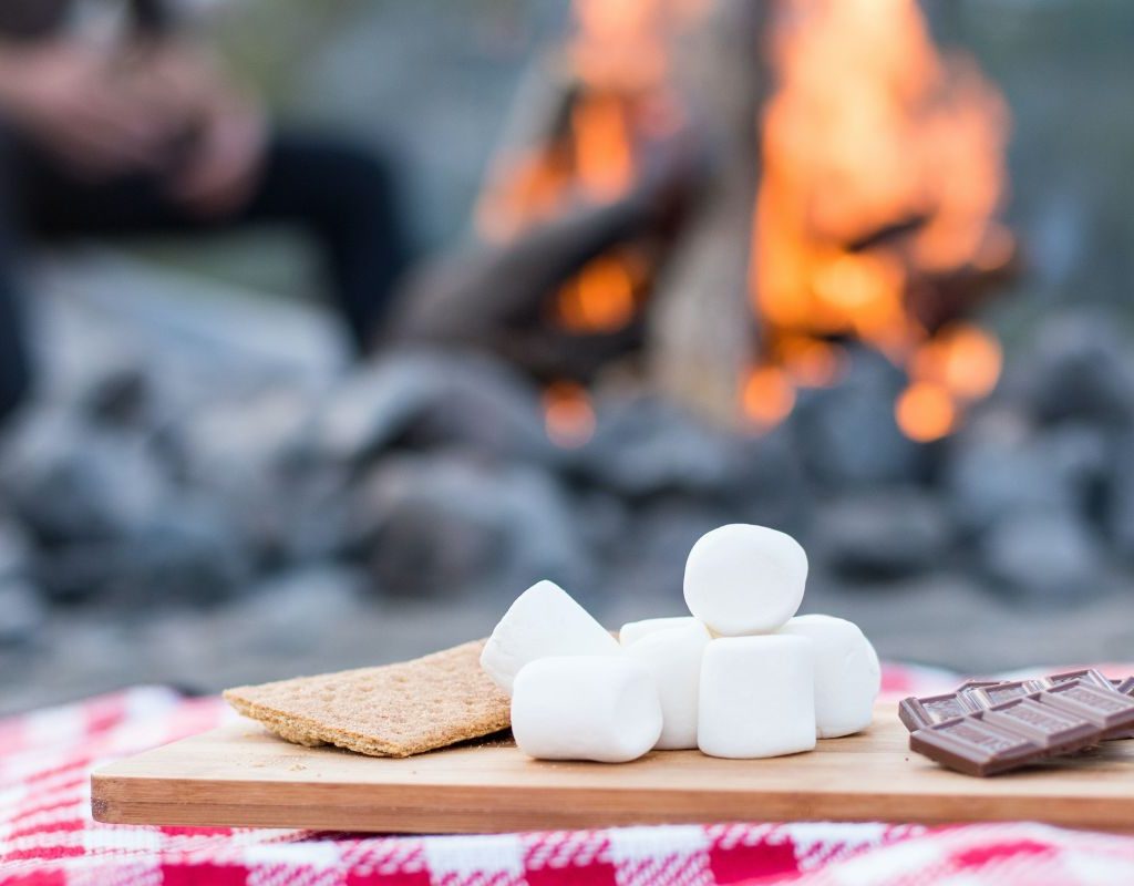 Making smores around a campfire