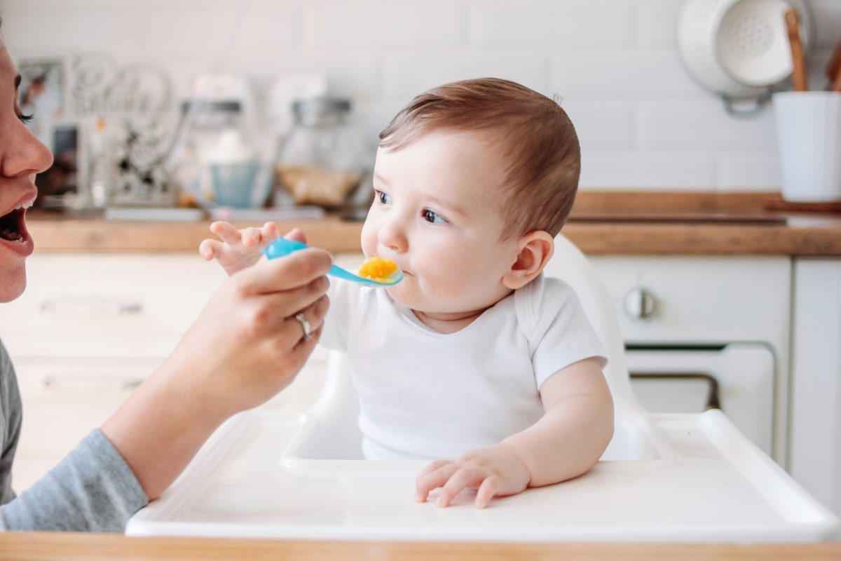Baby eating pumpkin