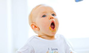 Baby opens mouth at the sight of food