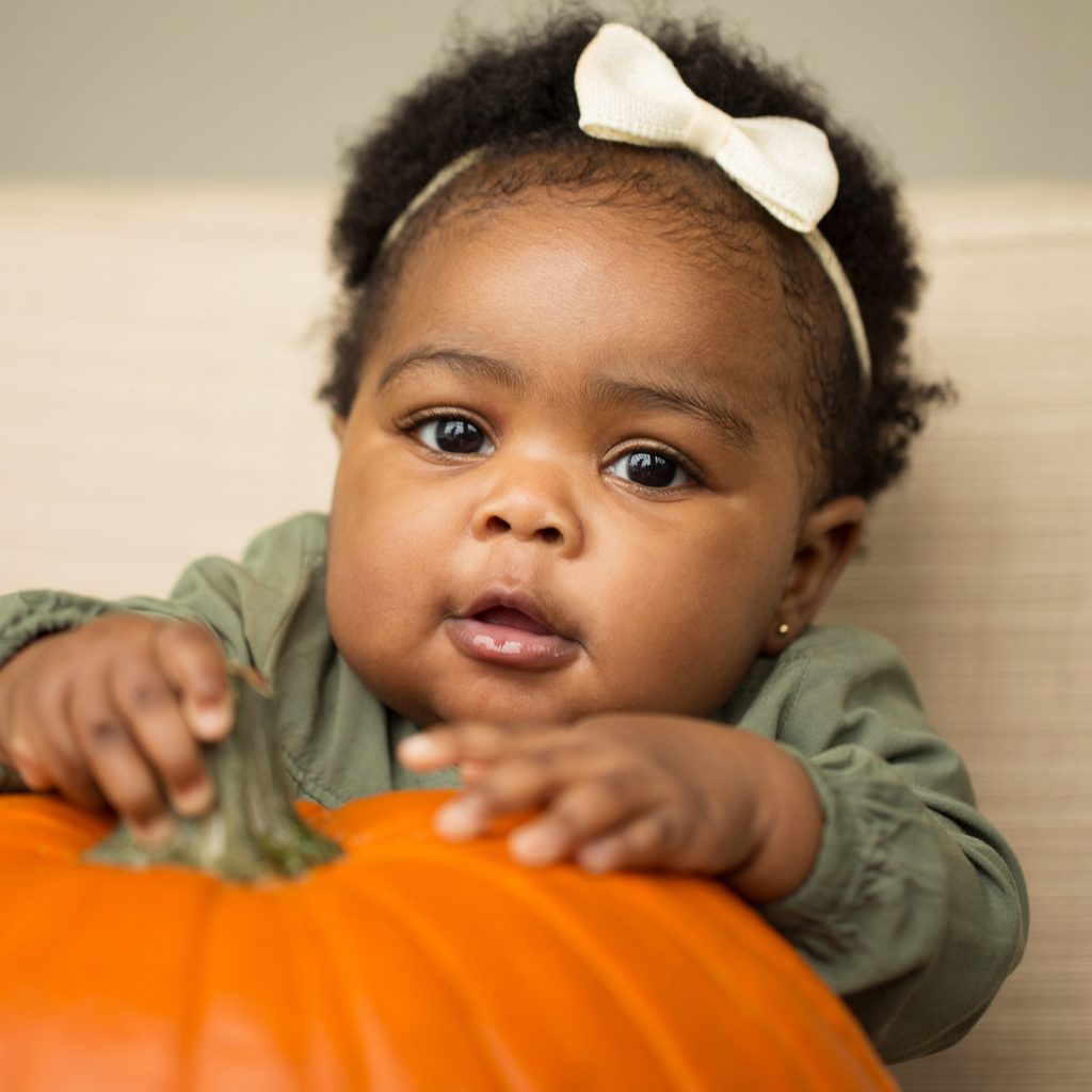 Baby with pumpkin