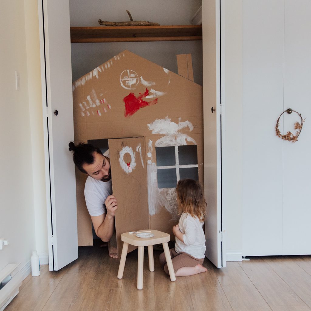 Dad and daughter painting play house