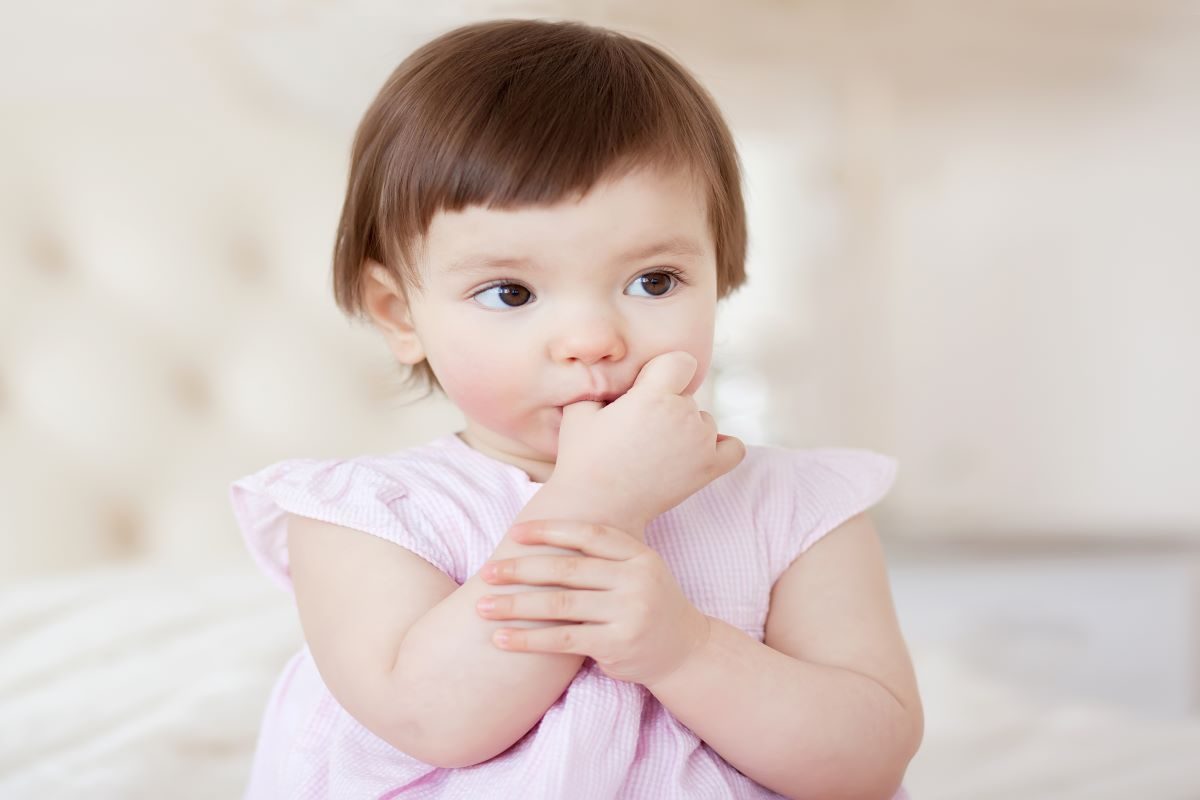 Little girl sucking on her thumb