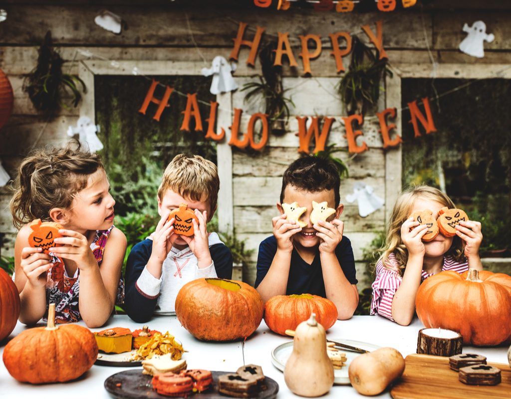 A group of kids doing a Halloween activity.