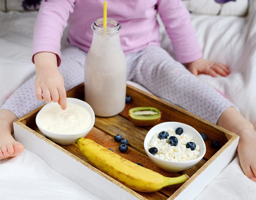 A toddler with their lunch.