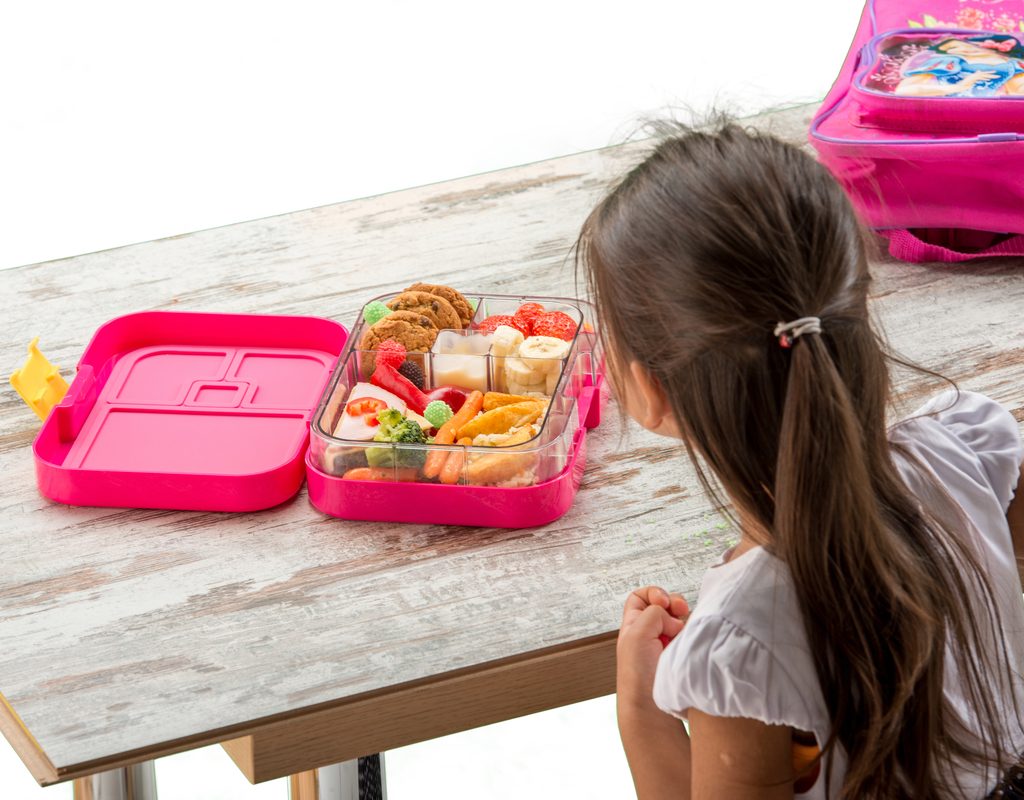 A child eating her school lunch.