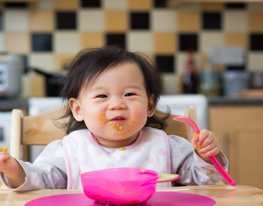 Baby with sweet potatoes