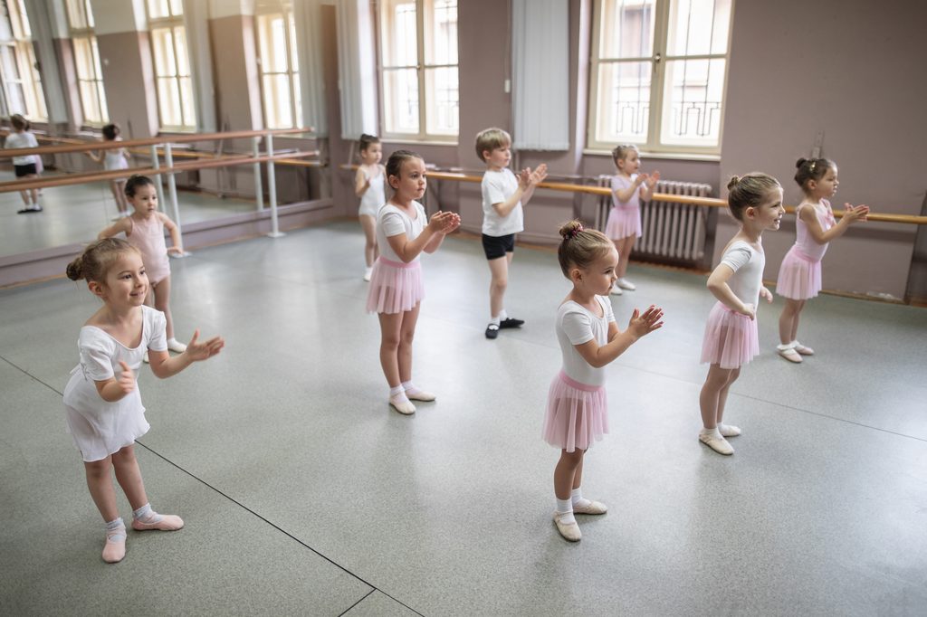 Cheerful toddlers at a ballet dancing studio