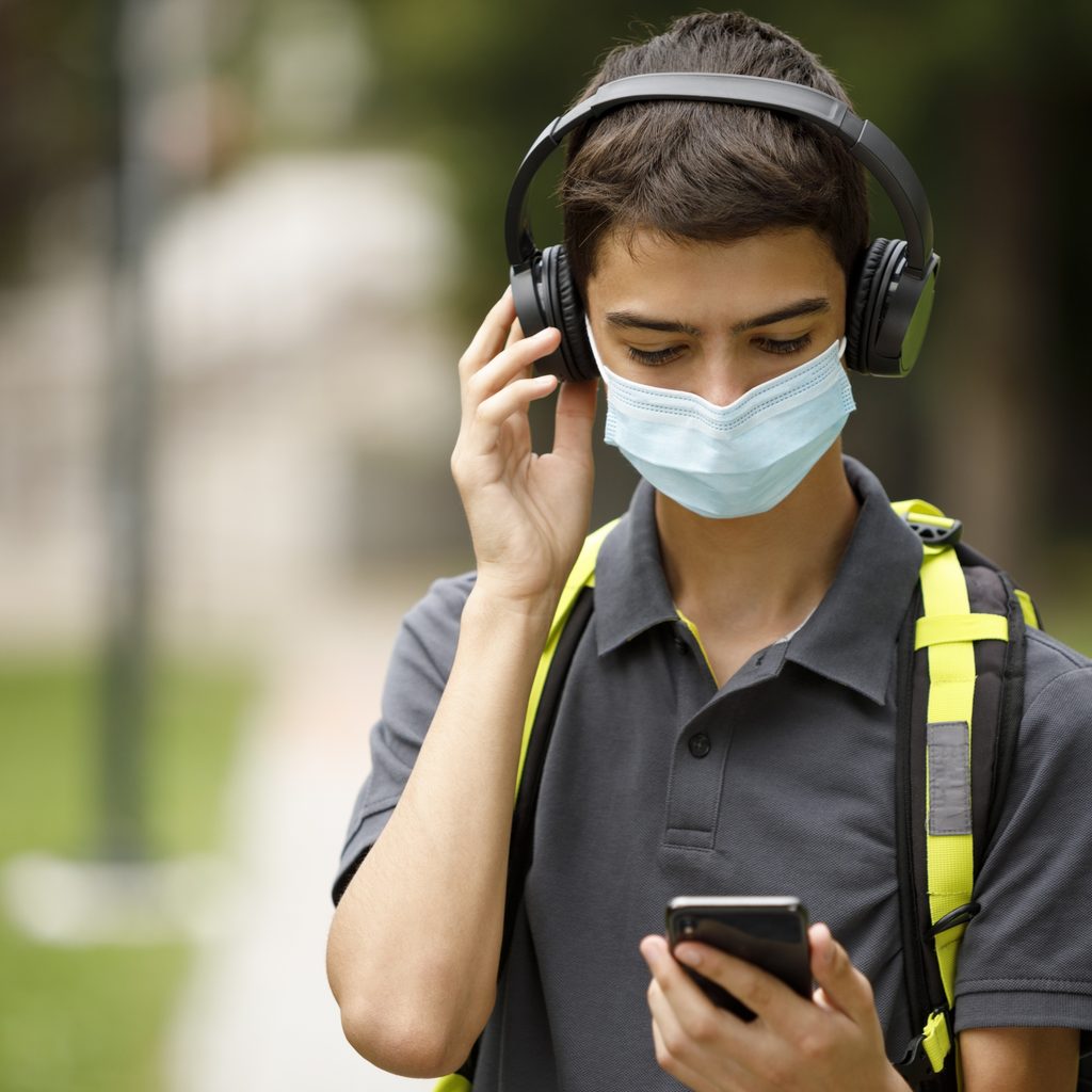 teen-boy-reading-about-coronavirus