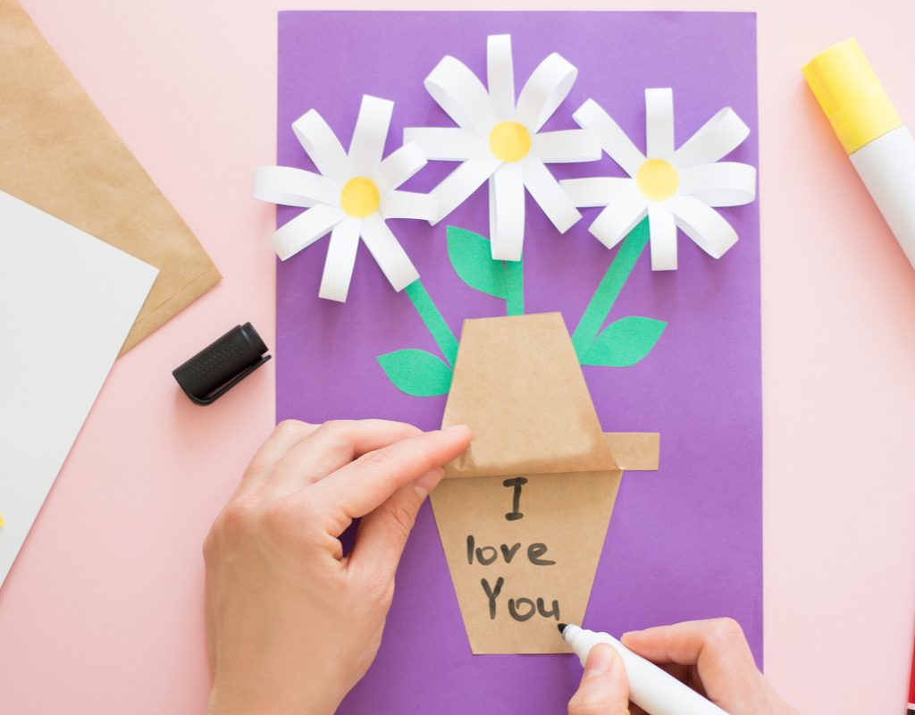 child making paper flower craft