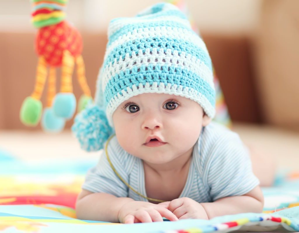 Baby boy wearing a blue knitted cap