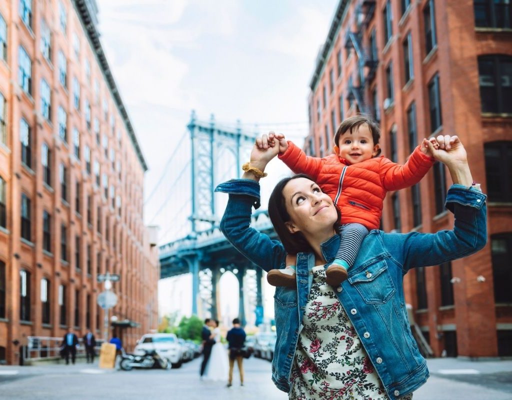 baby and mom in a city