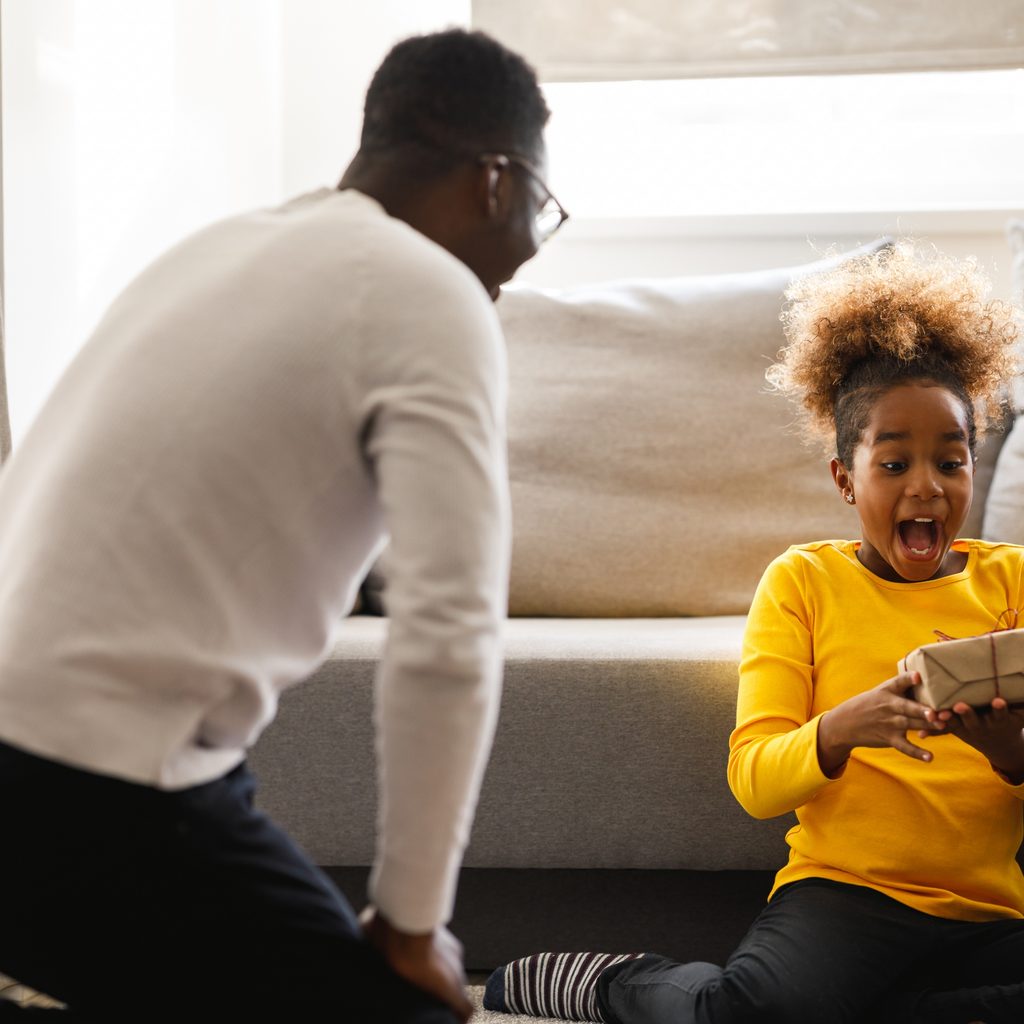 Young girl excited about her Christmas present