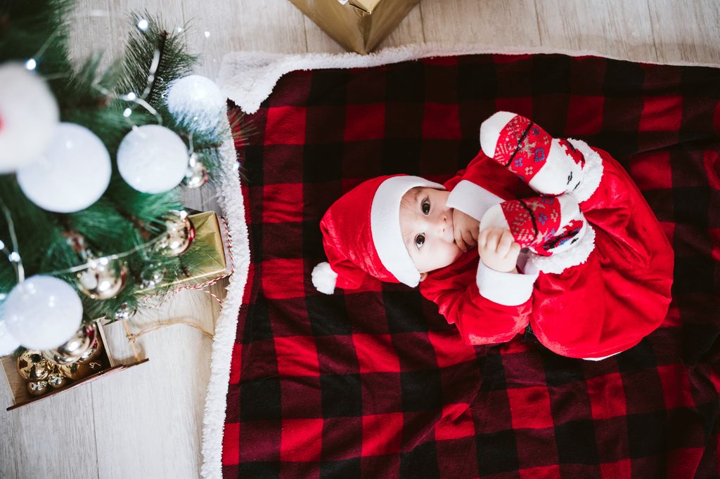 Baby on a blanket for first Christmas