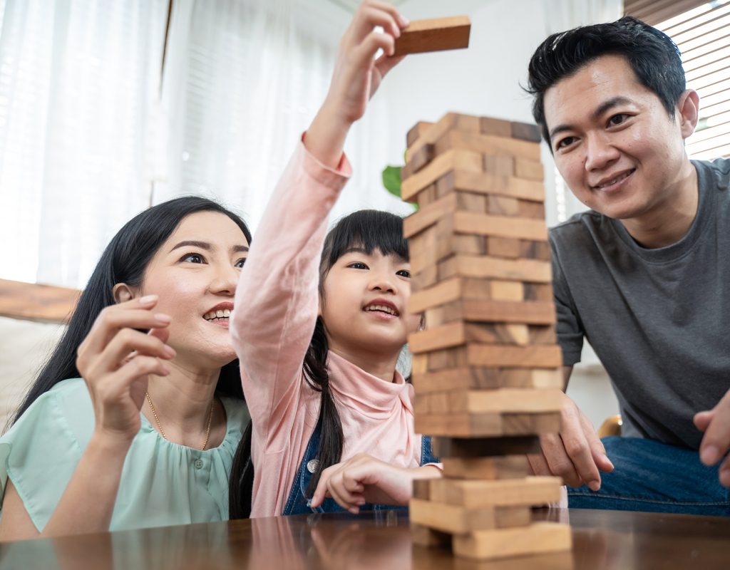Family playing Jenga together