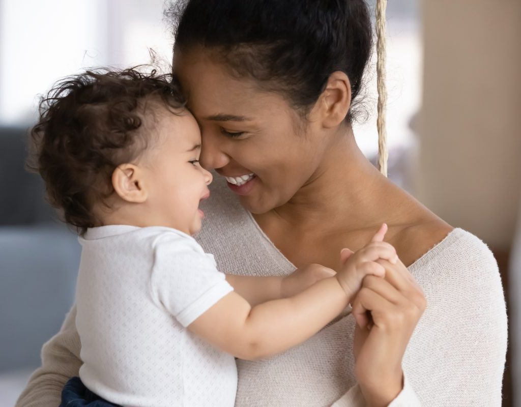 Woman holding a baby.