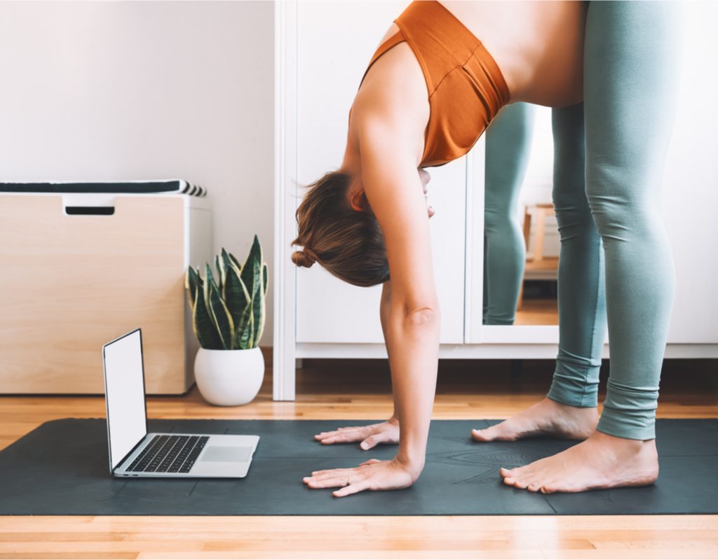 women doing yoga using a pregnancy yoga app