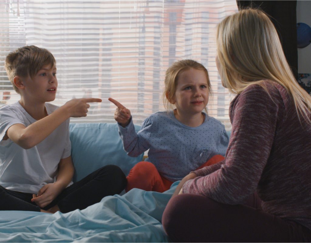 mom talking to fighting siblings