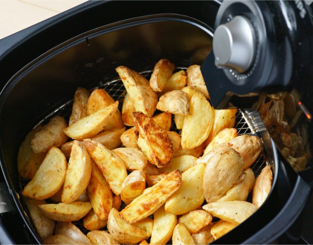 Potatoes cooking in an air fryer
