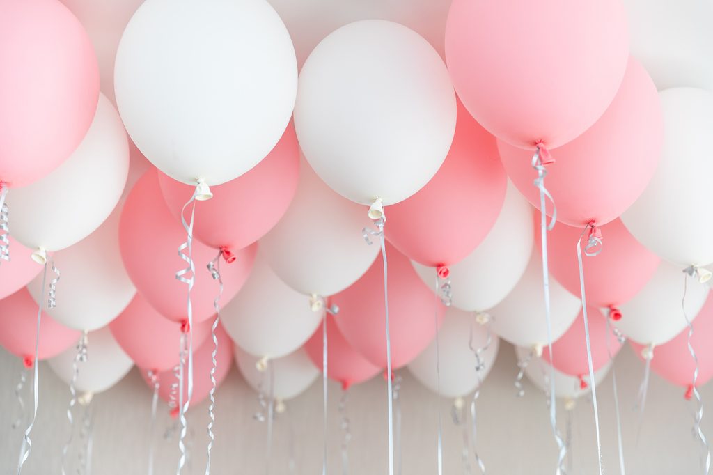 pink and white balloons for gender reveal party