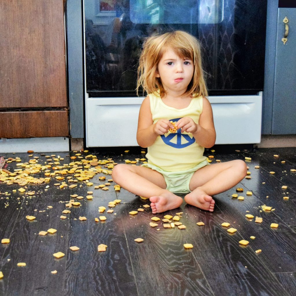 Toddler makes a mess on the floor