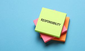 Post-it note with responsibility written on it