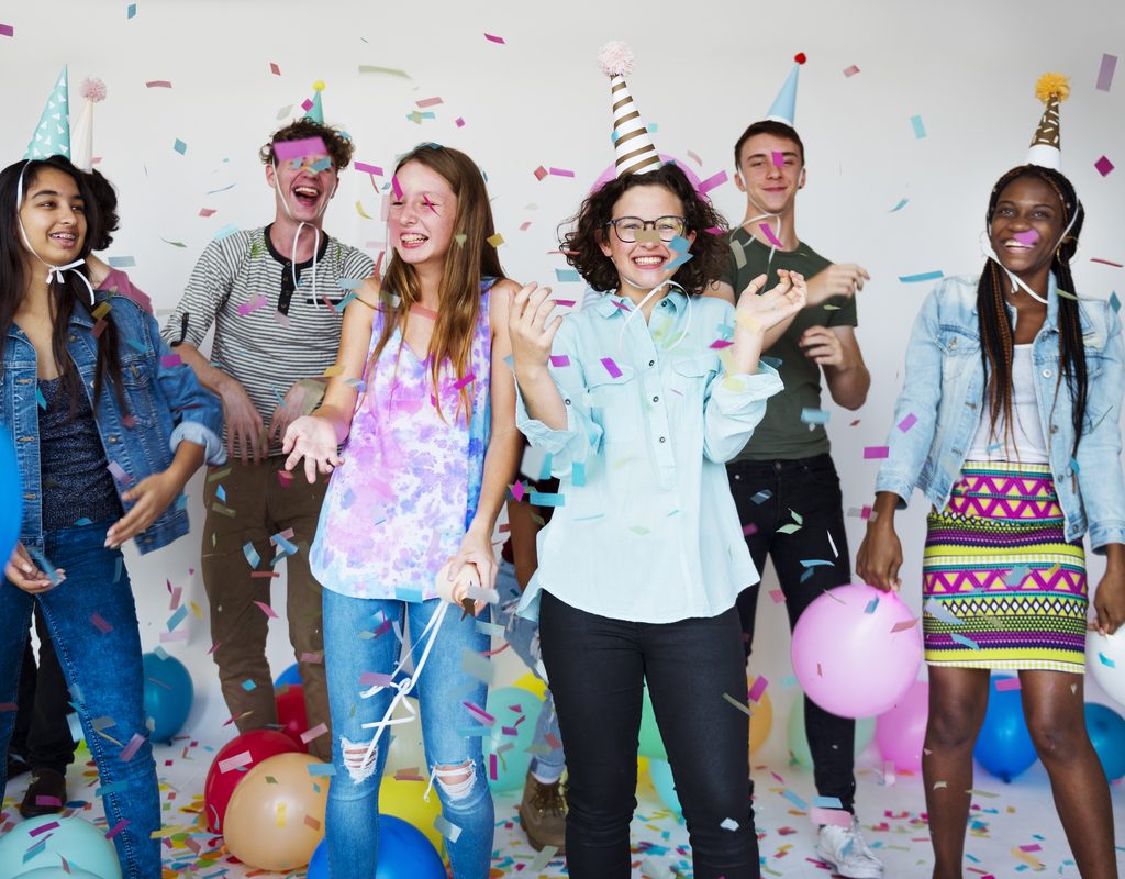 Teens having fun at a birthday party