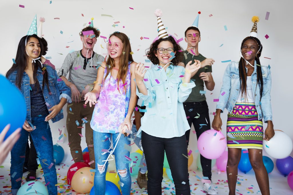 Teens having fun at a birthday party.