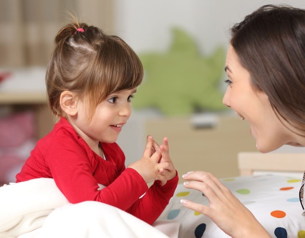 toddler and mom talking