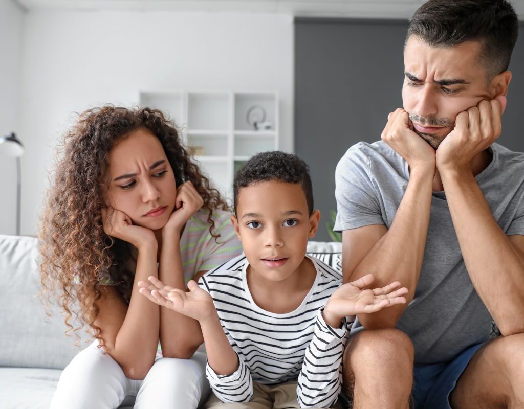 Parents looking at son perplexed