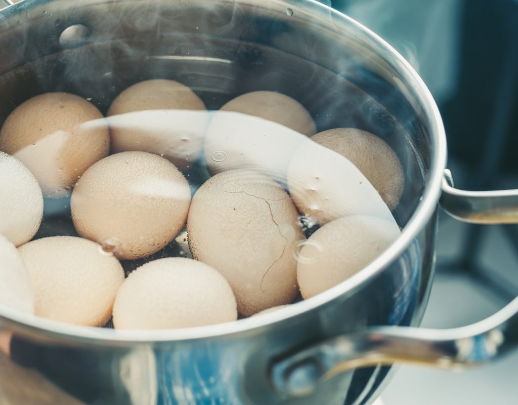 Boiled eggs in a pot of water