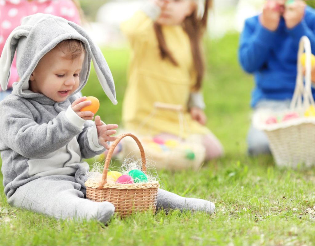 baby dressed as a bunny on an egg hunt