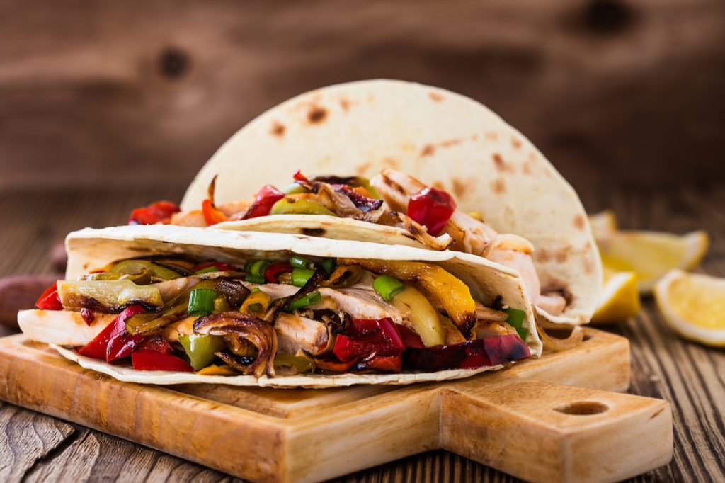 delicious chicken fajitas on a cutting board