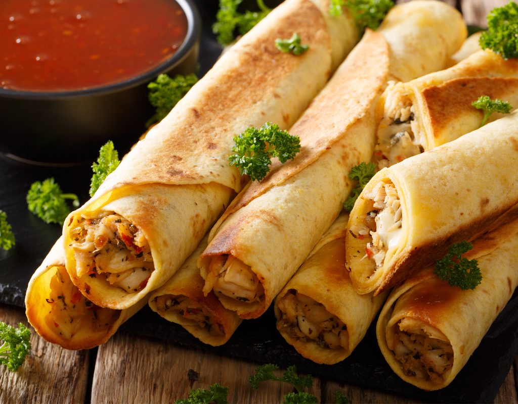 plate of chicken taquitos ready to eat