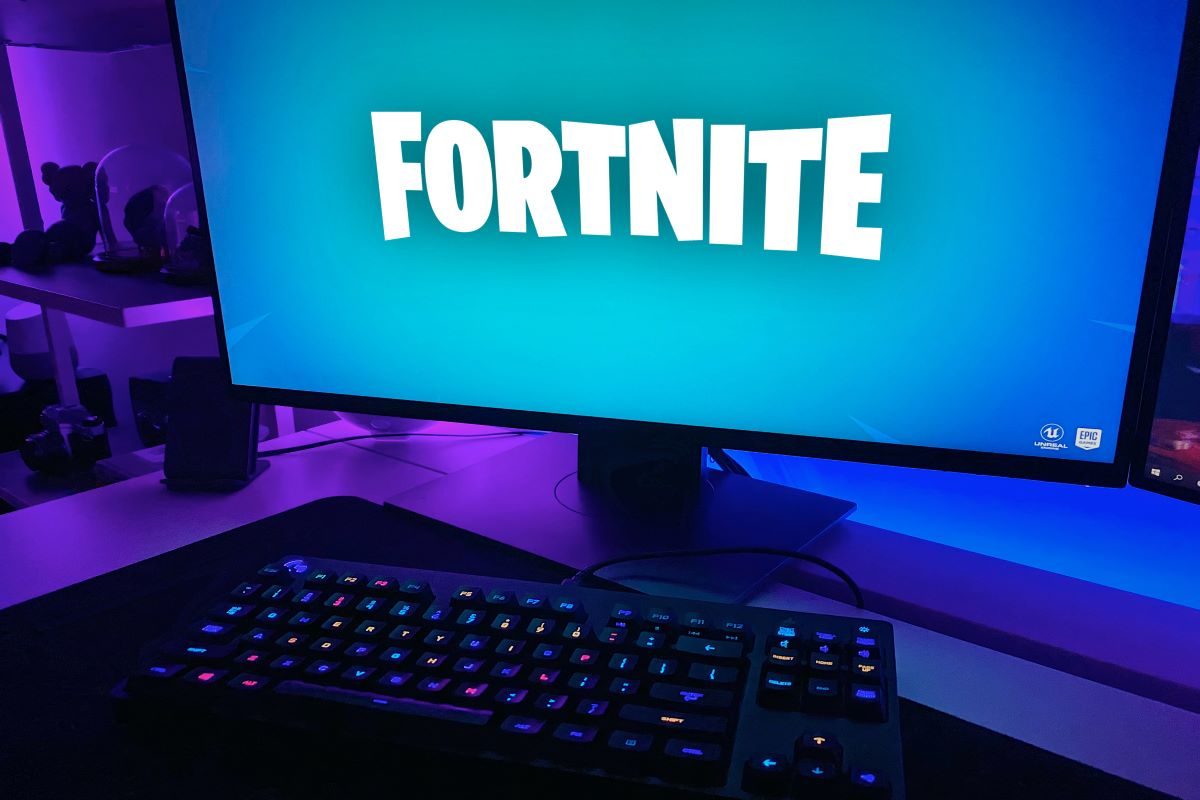 A computer monitor displaying the FortNite logo